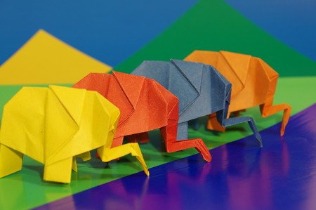 Paper origami elephant isolated on a colorful backgroundの写真素材