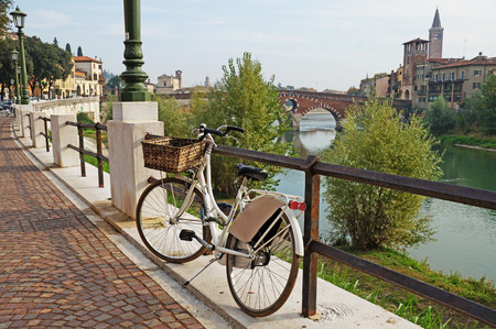 Bicycle on the background of the cityscape. A bicycle is parked in a beautiful city.のeditorial素材