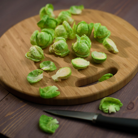 Brussels Sprout on wood cutting boardの写真素材