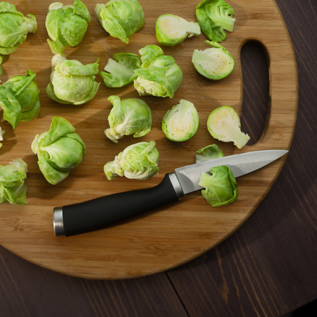 Brussels Sprout on wood cutting board top viewの写真素材