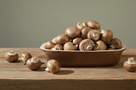 Mushrooms composition on wood table