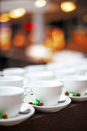 empty cups in cafe with sweets defocused compositionの写真素材