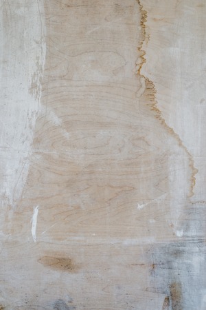 Texture of weathered light painted plywood with stainsの写真素材