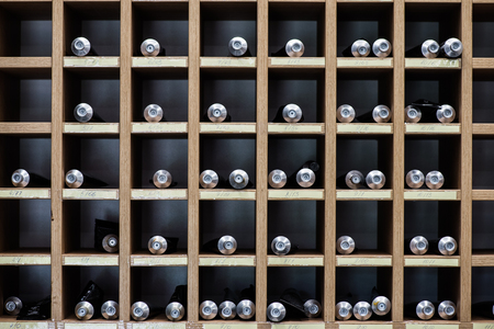 Hairdresser's rack containing tubes with a paint for hair at barbershop for use as background or textureの写真素材