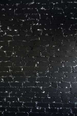 The brick texture with cracks and scratches can be used as a backgroundの写真素材