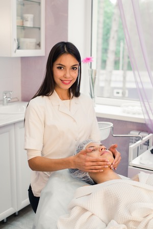 Woman cosmetologist to work in beauty salon.の写真素材