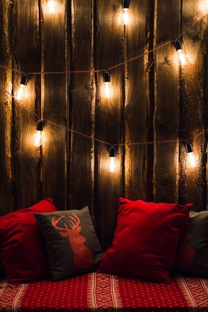 Deer head on red pillow background in interior.の写真素材