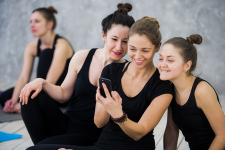 Yoga class of cheerful millennial friends people takes a selfieの写真素材