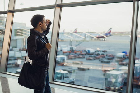 Silhouette of man waiting for the flightの写真素材