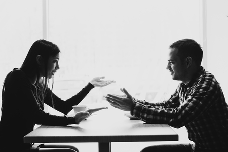 Scene in cafe - couple conflict arguing during the lunch.の写真素材