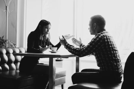 Scene in cafe - couple conflict arguing during the lunch.の写真素材
