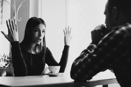 Young couple arguing in a cafe. Relationship problems.の写真素材