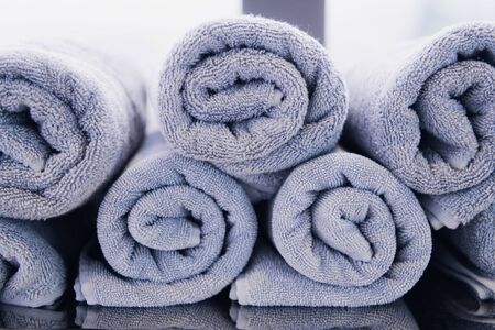 close-up twisted towels on the shelf. Shallow focusの写真素材