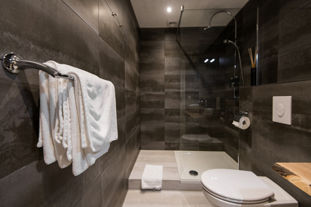Modern private bathroom interior. Towels on a hangerの写真素材