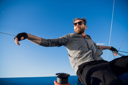 Handsome man resting On Yacht in the open sea on cruise.の写真素材