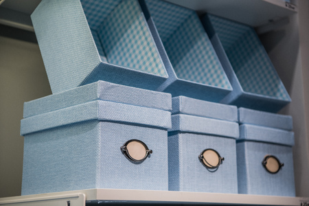 Fancy blue textile gift storage box on a shelfの写真素材