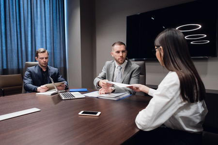 Startup business, creative business people of different age and races gather in meeting room in dark...
