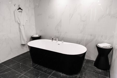 Modern minimalism style bathroom interior in black and white tones
