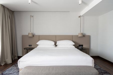 Superior bedroom at luxury hotel with a queen size bedの写真素材