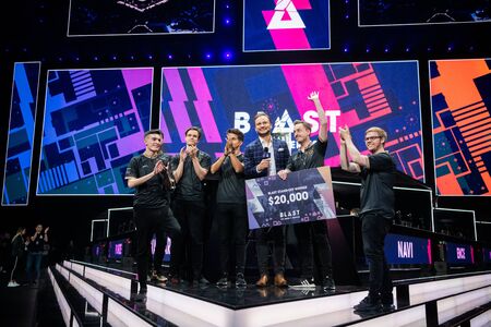 MOSCOW, RUSSIA - 14th SEPTEMBER 2019: esports event of a Counter Strike game. Winners of a standoff tournament team Ninjas in Pyjamas with a check in their hands with a prize money.のeditorial素材
