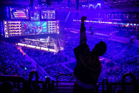 MOSCOW, RUSSIA - 14th SEPTEMBER 2019: esports Counter-Strike: Global Offensive event. Fan on a tribune at tournaments arena with hands raised.のeditorial素材