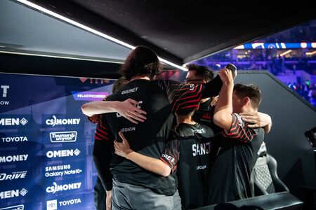 MOSCOW, RUSSIA - 14th SEPTEMBER 2019: esports Counter-Strike: Global Offensive event. The winner of tournament team Avangar on a stage with a cup award. Celebrating a win.のeditorial素材