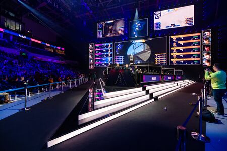 MOSCOW, RUSSIA - 14th SEPTEMBER 2019: esports Counter Strike: Global Offensive event. Tournament casters or commentators at main venue watching the game and broacasting it to the live stream on internet.のeditorial素材