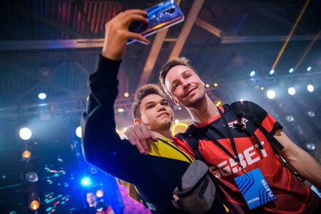 MOSCOW - DECEMBER 23 2019: esports Counter-Strike: Global Offensive event. Happy dedicated games fan making selfie with danish professional player Casper cadiaN Moller.のeditorial素材