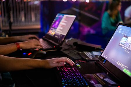 MOSCOW - DECEMBER 23 2019: esports Counter-Strike: Global Offensive event. Close up of cyber sport gamer play game and click the mouseのeditorial素材