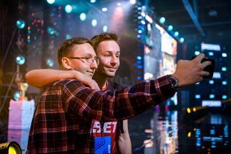 MOSCOW - DECEMBER 23 2019: esports Counter-Strike: Global Offensive event. Happy dedicated games fan making selfie with danish professional player Casper cadiaN Moller.のeditorial素材