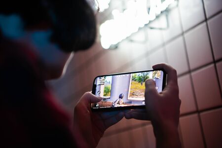 MOSCOW, RUSSIA - December 2019: Playing a PUBG Mobile battle royale games on Apple Iphone 11 Pro gaming smart phone.のeditorial素材
