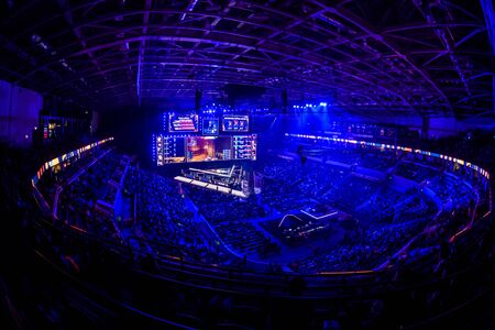 MOSCOW, RUSSIA - 14th SEPTEMBER 2019: esports Counter-Strike: Global Offensive event. Big illuminated main stage of a computer games tournament located on a big stadium. Tribunes are full of video games fans.のeditorial素材