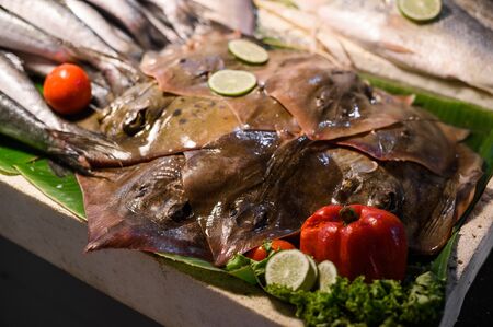 Fresh rays at the fish market. Raw stingray seafood at the night market