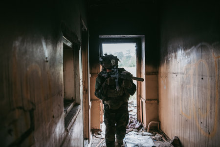 Soldier in combat. Urban combat training, soldier entering abandoned building. Anti terrorist...