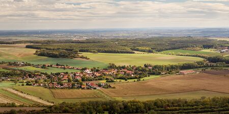 Rural landscape with village (Ctineves) and fields, blue sky with white clouds, view from Rip mountain, Czech republicの写真素材