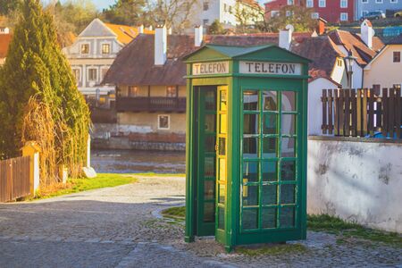 Phone Booth - green telephone booth in old town near Cesky Krumlov, Czech republicの写真素材