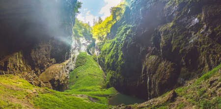 Macocha Gorge - The Macocha Abyss. Sinkhole in the Moravian Karst Punkva caves system of the Czech Republic. View from the bottom of the abyss.の写真素材
