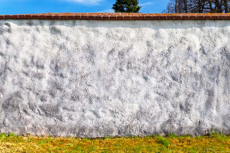 white wall, blue sky in the backgroundの写真素材
