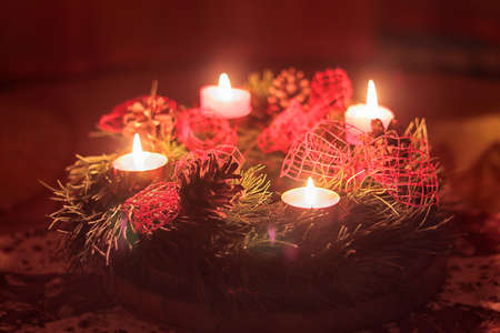 Advent wreath with glowing candlesの写真素材