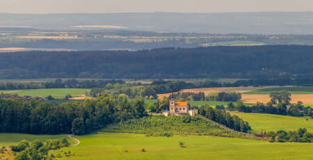 landscape with a church on a hill, pilgrimage Church of Our Lady of Sorrows, Mala Lhota, Czech republicの写真素材
