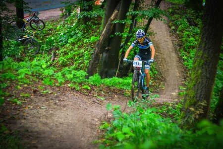 Lviv, Ukraine - August 17, 2016: MTB cyclist V. Skubenko competing in the forest near Lviv in Ukraine at 4th round of amateur xc cup of Ukraine 2016.のeditorial素材
