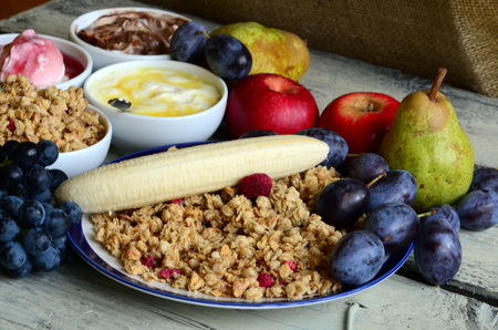 Fruit muesli with yogurt and cereals for breakfast