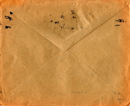 Back of an old used envelope. Rich stain and paper details. Can be used as background.のeditorial素材