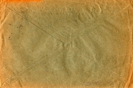Back of an old used envelope. Rich stain and paper details. Can be used as background.の写真素材