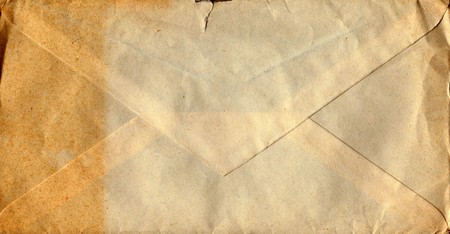 Back of an old used envelope. Rich stain and paper details. Can be used as background.の写真素材