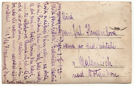 THE CZECHOSLOVAK REPUBLIC - MARCH 8, 1920: Back of a vintage photo - used postcard. Rich stain and paper details. Can be used as background. Image contains handwriting.のeditorial素材