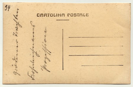 Back of a vintage photo - postcard. Rich stain and paper details. Can be used as background.の写真素材