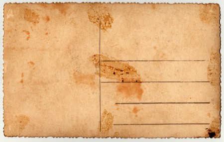 Back of a vintage photo - postcard. Rich stain and paper details. Can be used as background.の写真素材