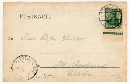 BERLIN, GERMANY - CIRCA 1930s: Back of a vintage photo - used postcard. Rich stain and paper details. Can be used as background. Image contains handwriting.のeditorial素材