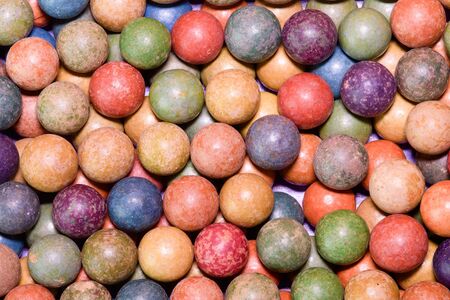 Clay marbles (balls). Retro toys. Vintage toys. Shoot (roll/play) marbles. Image can be used as background.の写真素材